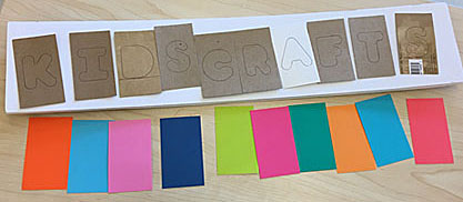 Planning the placement and colors of cutout letters on a sign
