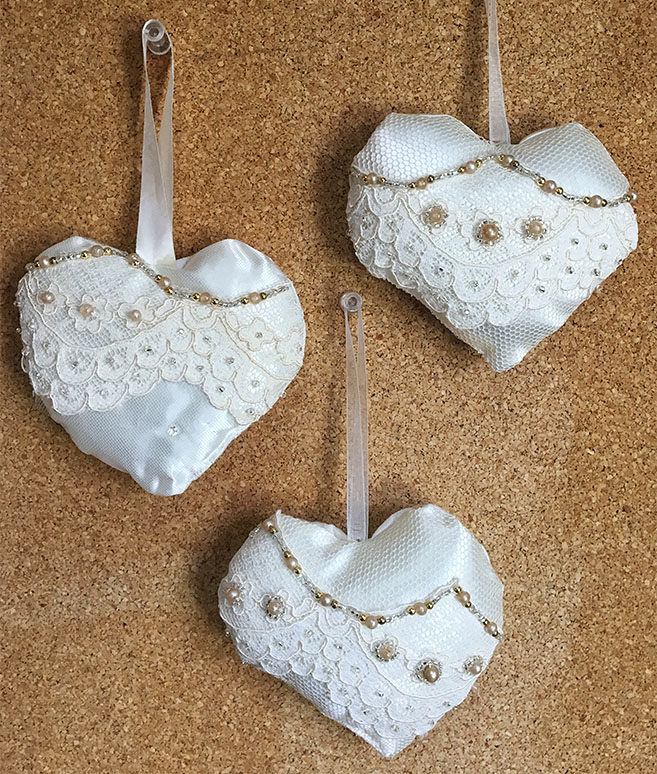 Three softie hanging hearts made from upcycled fabric